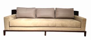 Aspre Sofa by Christian Liaigre at Holly Hunt: Designed by Christian Liaigre (1844-2020). Sofa with curved, exposed wood back in Macassar Ebony veneer, with a solid walnut wood base, stained to match. Single loose seat cushion in a tan ultra-suede