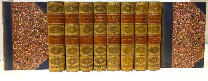 Dickens' Works (Library Edition, 12 volumes): Dickens, Charles. Works. Library Edition. London: Chapman and Hall, 1874. 10 volumes (of original 30) of works by Charles Dickens, bound in 3/4 dark blue calf over marbled boards; spines are faded gr