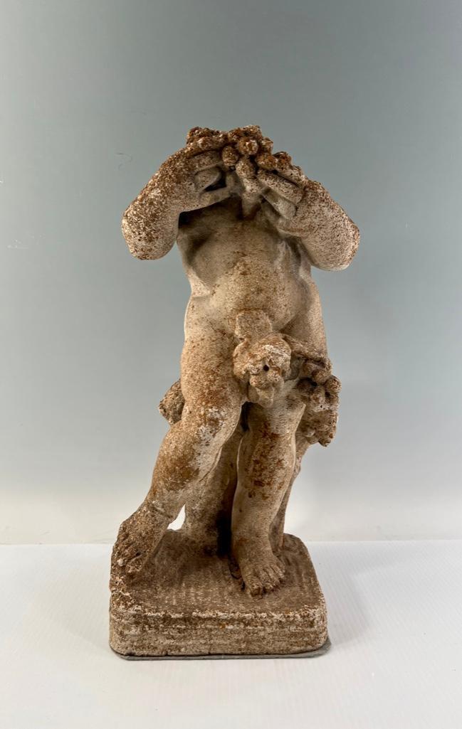 Cast Stone Figure of a Putto, Headless: Cast Stone Figure of a Putto, Headless, standing figure emblematic of Summer, holding bunches of grapes. Dimensions: 19 x 8 x 8 in. Condition: Lacking head and with wear from outdoor use.