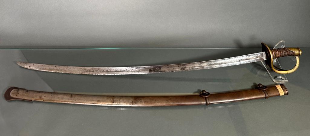 Heavy Cavalry Saber by W. Walscheid: Marked blade, W. Walscheid Solingen, brass guard, wire wrapped leather grip, helmet pommel, apprx 40-1/2"L. Condition: blade with wear to edge, wire wrapping loose and leather with wear and losses