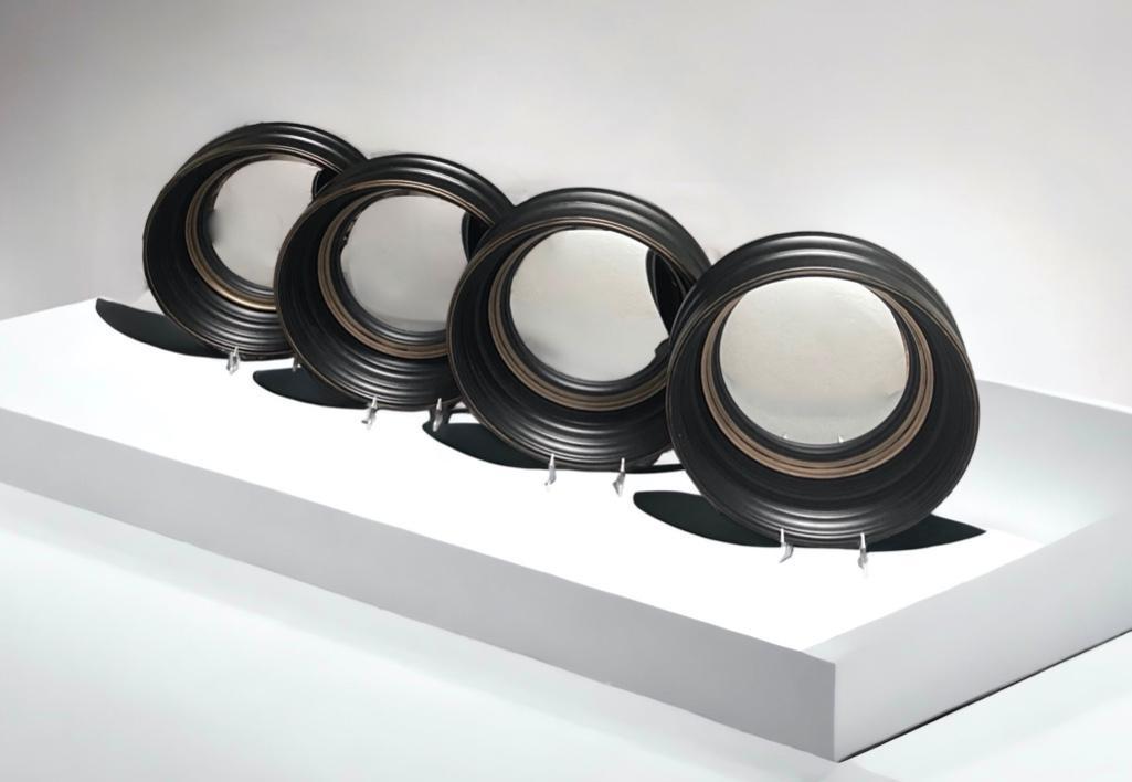 Four Decorative Convex Mirrors, Contemporary: Four Decorative Convex Mirrors, Contemporary, ebonized and gilded finish. Dimensions: 14 in. dia. 3 in. d. Condition: Very good.