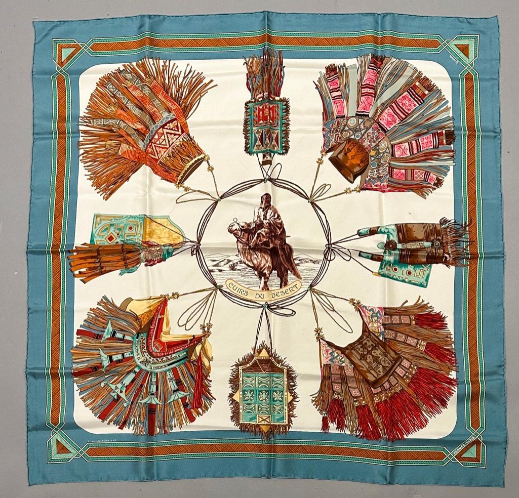 Hermes Silk Twill Scarf, " Cuirs du Desert ": Hermes Silk Twill Scarf, " Cuirs du Desert " designed by F.de la Perriere, depicting leather of the desert with assorted fringed and tasseled bags. Titled and signed Hermes-Paris, with Hermes