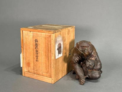Japanese Bronze Okimono, Monkey Family by Hori Kuzukiyo: Japanese Bronze Monkey Family: Hori Kuzukiyo, probably 1912 in date, is a fine casting of a mother and baby monkey playing with a toy. The okimono, a small decorative object for display, humanizes the