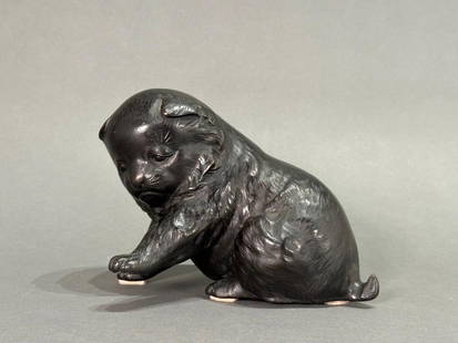 Japanese Bronze Sculpture of a Puppy, Sho Kore, Meiji Period: Japanese Bronze Sculpture of a Puppy, Sho Kore, Meiji Period, seated puppy with one paw lifted in play, with detailed fur and expression. Stamped signature to base. Dimensions: 5.5 x 6.5 x 5 in. Condi