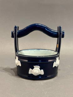 Japanese Hirado Porcelain Bucket: Japanese Hirado Porcelain Bucket, probably 19th-20th century in date, takes its shape from a wooden bucket. The exterior is painted with deep cobalt blue and molded with birds reserved in white on the