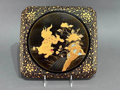 Japanese Lacquer Document Box: Japanese Lacquer Document Box, footed squared form with scalloped corners decorated in hiramaki-e to the top with an energetic leaping shi-shi in gold and silver lacquer, with a flowing stream and