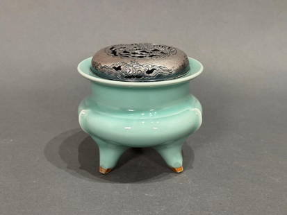 Japanese Celadon Tripod Koro, Suwa Sozan II: Japanese Celadon Tripod Koro, c. 1935-1950's, takes its shape from an archaic bronze vessel. It is the work of Sozan II (Japanese 1890-1977), the daughter of Suwa Sozan I, an Imperial Court artist