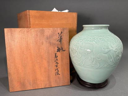 Japanese Celadon Glaze Porcelain Vase, Miyanaga Tozan I: Japanese Celadon Glaze Porcelain Vase, Miyanaga Tozan I (Japanese 1868-1941) Baluster form vase finely incised around the form with a foliate and floral scroll enclosing three wild shi-shi lions in ex