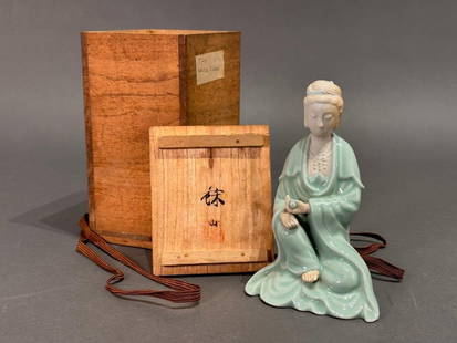 Japanese Celadon Glazed Porcelain Okimono of Kannon by Suwa Sozan: Japanese Celadon Glazed Porcelain Okimono of Kannon by Suwa Sozan, early 20thc. The Goddess of Mercy modeled seated with both hands resting on one knee, wearing a ruyi necklace, with one hand holding