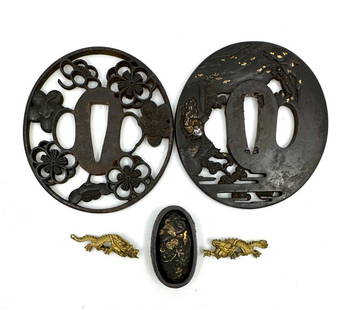 Lot of 2 Japanese Tsuba and Sword Fittings: Lot of 2 Japanese Tsuba and Sword Fittings includes 2 brass menuki in the shape of dragons and fuchigashira intricately cast with birds and flower motifs. The tsuba include one with open-work motifs o