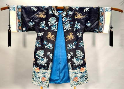 Chinese Embroidered Silk Robe: Chinese Embroidered Silk Robe, probably 19th century in date, is an exquisite example of imperial-style robes created in workshops for members of the court. The butterflies and peony motifs suggest th