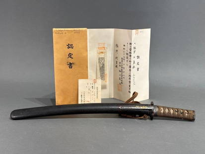 Japanese Sword: Mino School c. 1450: Japanese Sword: Mino School c. 1450 is a short sword, wakizashi, generally worn with a longer sword. The tsuka is wrapped with a menuki in shape of gilt pine cone. The kozuka on the sheath is cast wit
