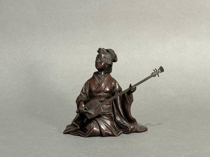 Japanese Bronze Okimono of a Seated Beauty Playing the Koto: Japanese Bronze Okimono of a Seated Beauty Playing the Koto, Meiji period, seated figure in traditional dress of. a courtesan with sculpted hairdo, playing the Koto. Signed to base. Dimensions: 4.5 in