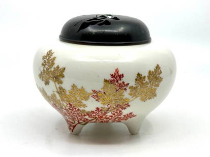 Japanese Porcelain Censer with Bronze Cover by Tozan Ito, Meiji Period: Japanese Porcelain Censer with Bronze Cover by Tozan Ito, Meiji Period, of bulbous form on short tripod feet, decorated with leafy branches in gilding and iron red overglaze to the base of the form, w