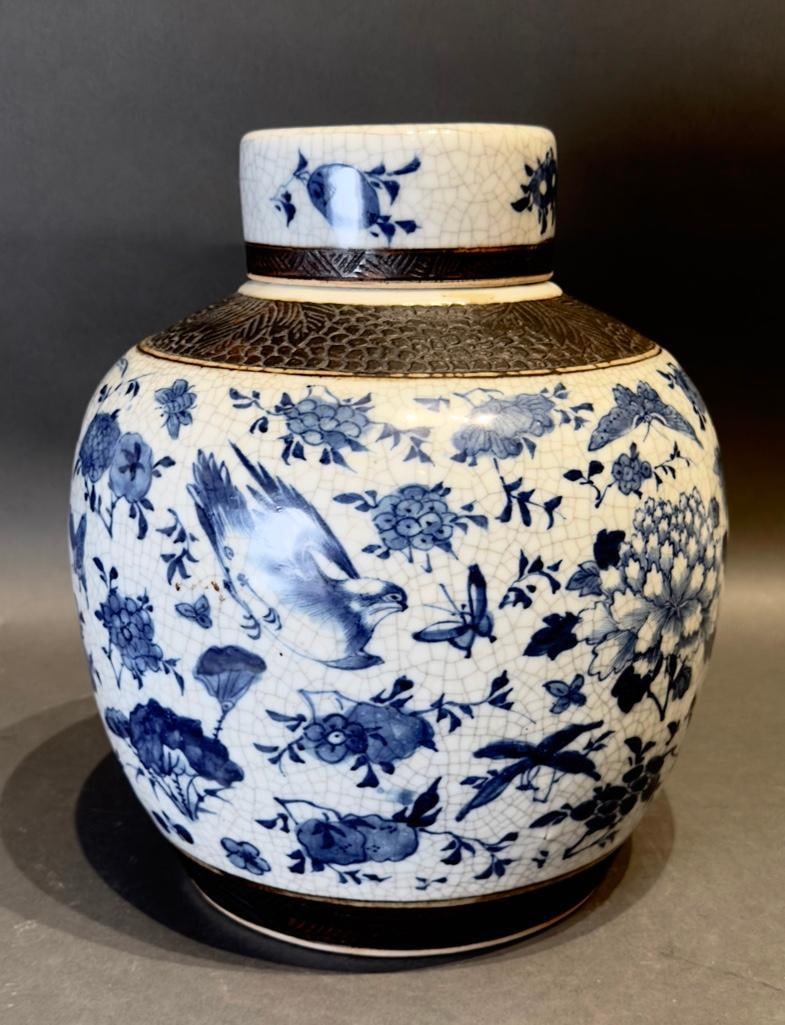 Chinese Antique Blue and White Porcelain Ginger Jar: Chinese Antique Blue and White Porcelain Ginger Jar, probably late 19th century in date, boosts decorative motifs painted in blue on a crackled glaze ground. Auspicious symbols of peonies, butterflies