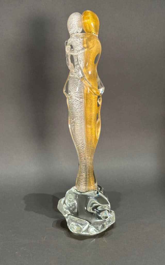 Attributted to Murano, Glass Sculpture: Embrace, clear colorless glass with gold flecks in both figures, embracing on a clear glass base. not signed, no sticker found. Apprx 19"T. Condition: excellent.