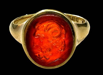 Roman Carnelian Intaglio Ring of Jupiter-Ammon, 1st Century BCE: Roman carnelian intaglio of Jupiter-Ammon, 1st Century BCE. With the god's head in profile facing left, luxuriant curled hair and beard and large curled ram's horns, in a later hallmarked 18K yellow