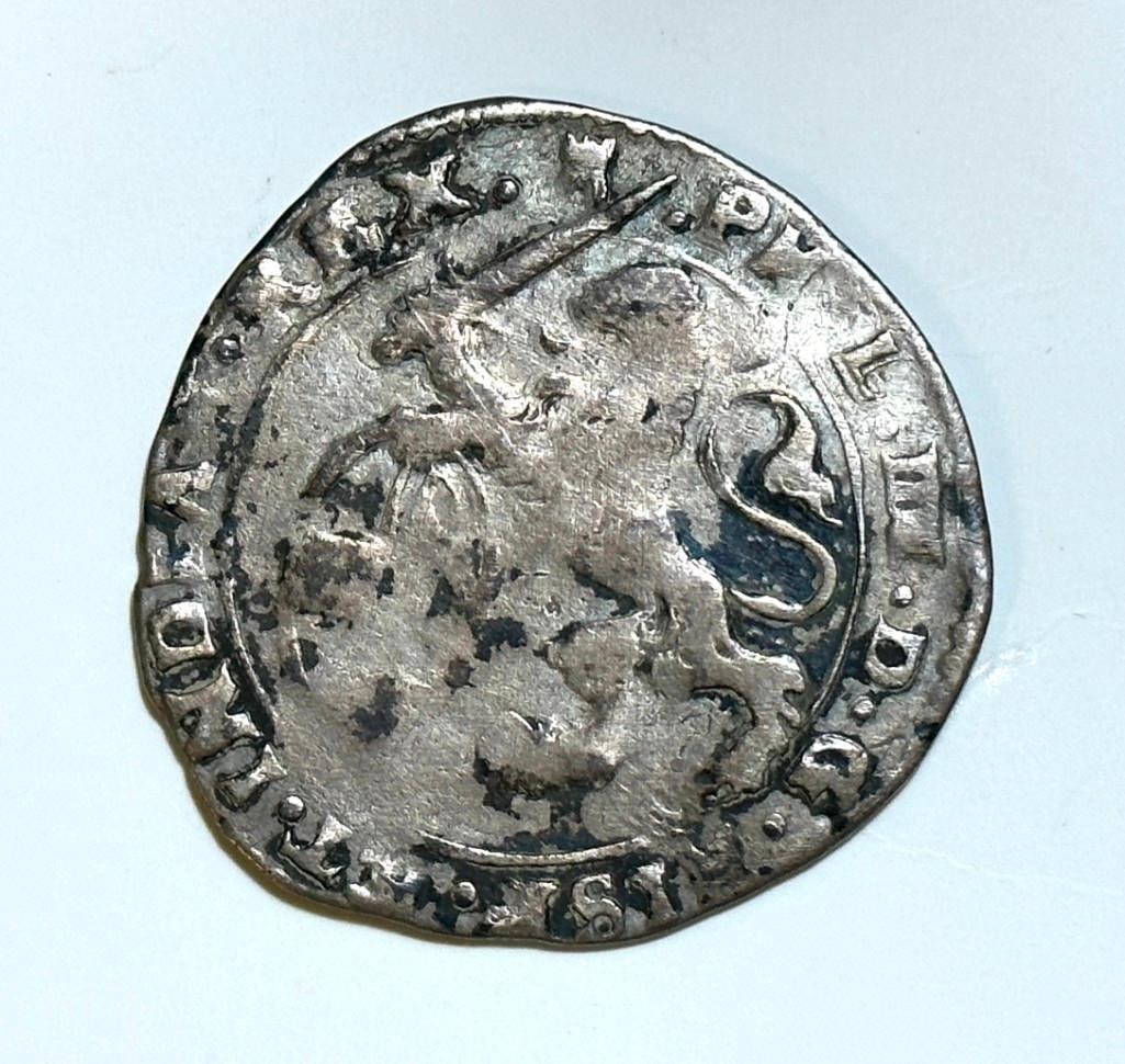 1642 Silver Gulden of King Philip IV (1621-1665): 1 Escalin - Philip IV, 1642 silver coin issued by the Spanish Netherlands (Lordship of Tournai, Belgian States), 30 mm. Obverse-lion standing creeping to the left holding a sword and holding a shield,