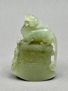 Chinese Carved Jade Bell: Chinese Carved Jade Bell, probably Qing Dynasty (1644-1912), is exquisitely carved with a hollow cavity for the bell. A mythical creature, the Qilin, is mounted on the top. Qilins, half dragons and