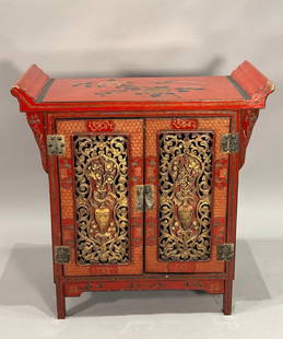 Chinese Red Cinnabar Lacquer Scroll Top Cabinet: Chinese Red Cinnabar Lacquer Scroll Top Cabinet, probably early 20th century in date, was created for an affluent household. The doors on front of the cabinet are exquisitely decorated with panels car