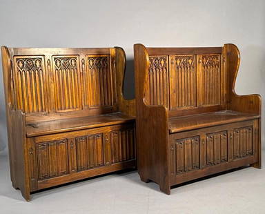 Pair of Gothic Style Lift Top Benches, Early 20thc.: Pair of Gothic Style Lift Top Benches, Early 20thc. Carved oak or walnut benches in the French Gothic style, with hinged seats opening to storage area, the front in carved linen fold, with decorative