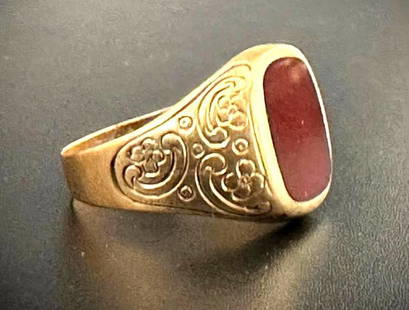 Carnelian and 14K Gold Signet Ring: Carnelian and 14K Gold Signet Ring, Hallmarked 585 W.P. on shank interior, the 14K yellow gold ring is hand chased with flowers on the sides of a bezel set square carnelian. Apprx 4.13 grams and ring