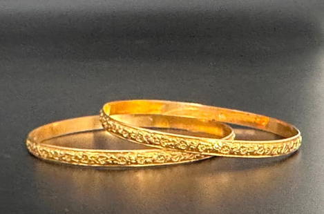 Pair of 18K Antique Gold Bangles: Pair of 18K Antique Gold Bangles, Art Nouveau design of leaves on a vine with fruit, identical bangles, apprx 21.06 grams total. Hallmarked 18K on both interiors. Apprx 2.5"D each. From the collection