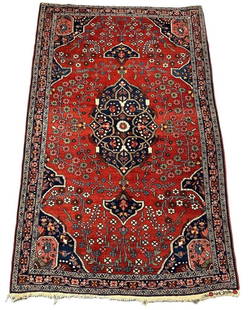 Persian Carpet, 6'8" x 4'4": Wool on cotton weft, Red ground lozenge on dark blue, outlined in thin beige border. The center has a dark blue medallion with small central flower with a curvilinear star, finished with a shaped spad