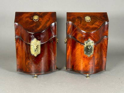 Pair of English George III Mahogany Cutlery Boxes, c.1790: Pair of English George III Mahogany Cutlery Boxes, c.1790, of serpentine form in nicely figured mahogany veneer with polished brass hardware, with floral ring handle at top, hinged plate escutcheon