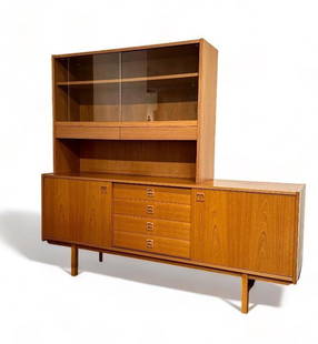 Swedish Mid Century Teakwood Sideboard: Swedish Teakwood Sideboard, c.1960&#39;s, in two parts, the rectangular base with a pair of sliding doors opening to shelves centering four drawers, topped by a freestanding superstructure with two sl