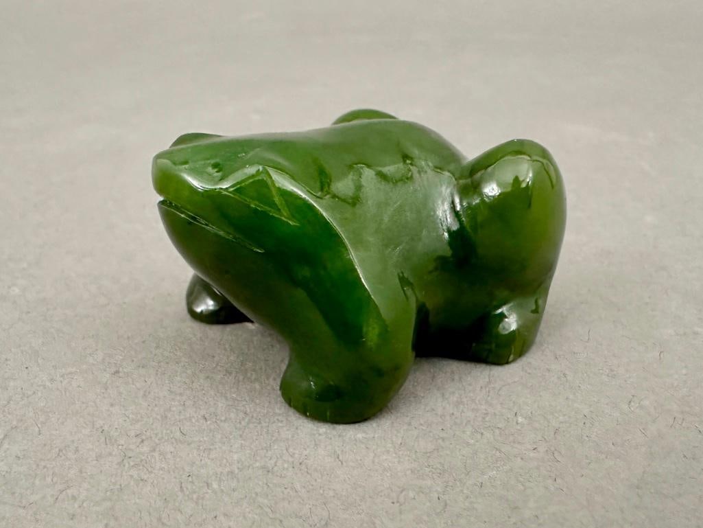 Carved Green Jade Figure of a Frog: Carved Green Jade Figure of a Frog, in mottled dark green jade polished to a high gloss. Dimensions: 2.25 x 1.5 in. Condition: Very good with no damage or restoration.
