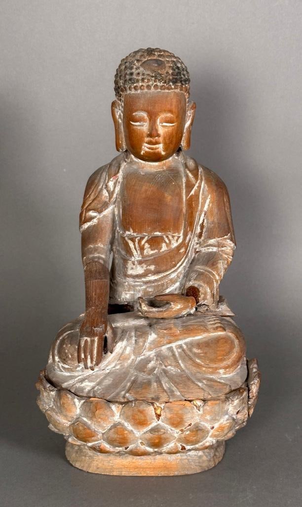 Japanese Carved Pine Figure of Seated Buddha: Japanese Carved Pine Figure of Seated Buddha, late 19th-early 20thc. In meditative pose seated on a lotus flower base, with traces of pigment and gilding. Dimensions: 13 in.h. x 7 in.w. Condition: Age