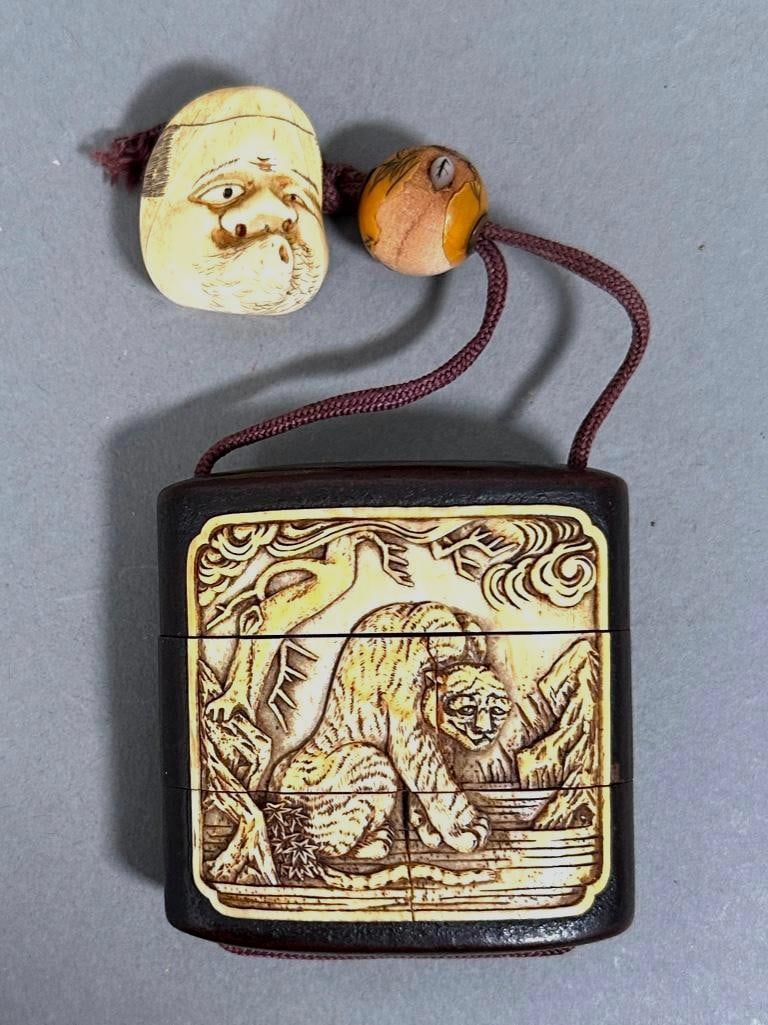 Japanese Wood and Bone Inro with Netsuke, Meiji: Japanese Wood and Bone Inro with Netsuke, Meiji period, the wood case inset with relief carved bone decoration of a Kirin against waves and clouds on one side, the other side carved with a Tiger seate