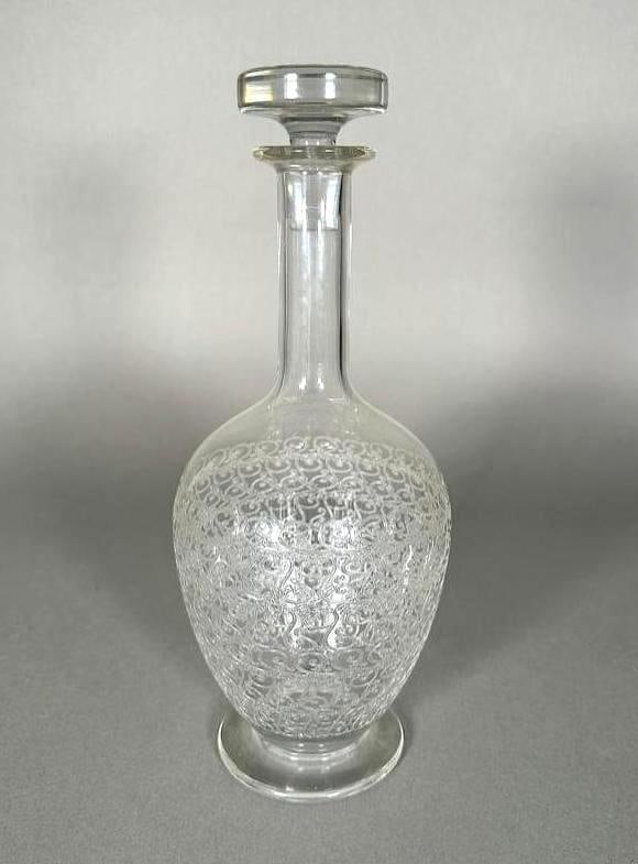 Baccarat Etched Glass Decanter: Baccarat Etched Glass Decanter, Ovoid shaped decanter with waisted neck, flaired foot-rim, with stopper, bottom with acid etched Baccarat France logo. Apprx 11"T. Condition: very good.