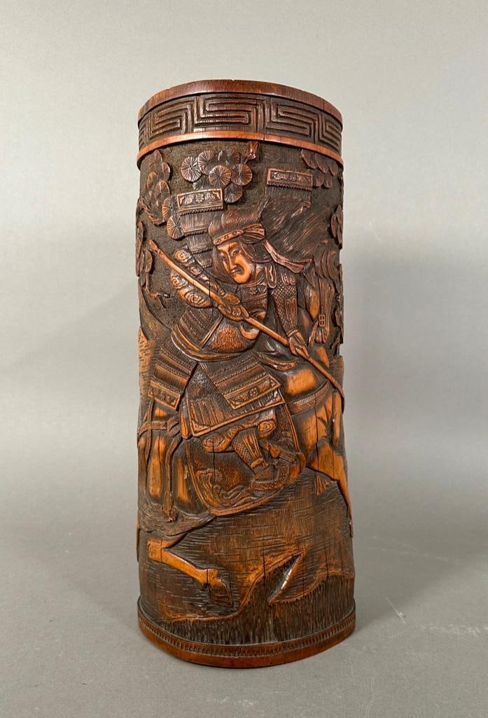Japanese Relief Carved Wood Vase: Japanese Relief Carved Wood Vase, depicting a Samural warrior on horseback in the mountains under old pine. Dimensions: 15 in.h.