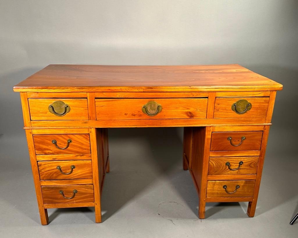 Chinese Elmwood Pedestal Desk: Chinese Elmwood Pedestal Desk, rectangular top with with three frieze drawers over pedestals, each with three short drawers, on squared feet, with metal hardware. Dimensions: 32.5 in.h. x 51 in. w. x 