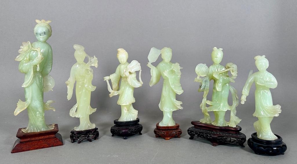 Six Carved Green Quartz Figures of Goddesses: Six Chinese Carved Green Quartz Figures of Goddesses, each standing figure holding an accouterment, on wood bases. Dimensions: 9.5 in. tallest. Condition: Good condition, Sold As Is, perhaps a chip or
