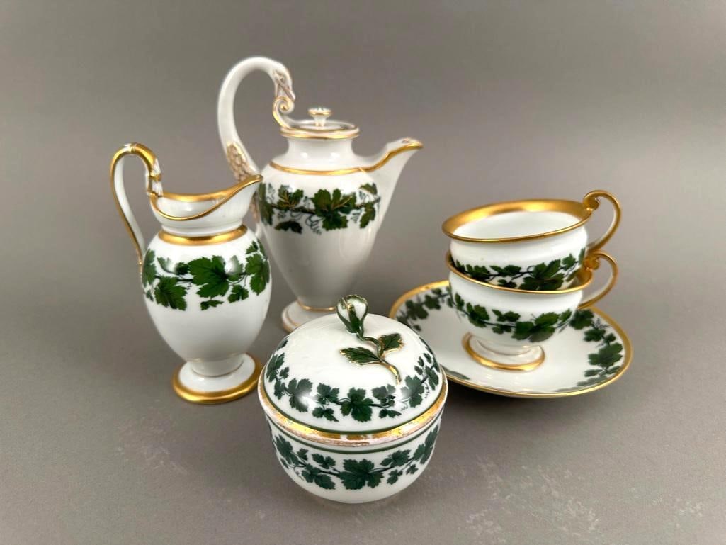 Meissen Porcelain Individual Hot Beverage Service: Meissen Porcelain Individual Hot Beverage Service, comprising Teapot, Creamer, Covered Sugar, two cups and one saucer, in Empire style decorated with grapevines and leaves around the forms in dark gre