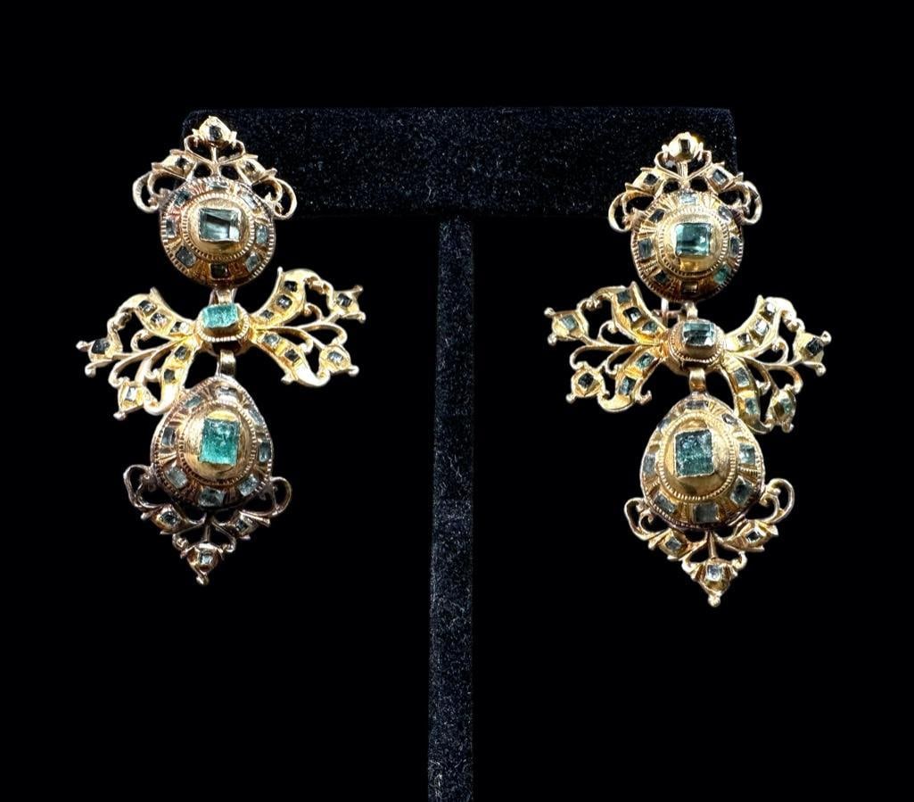 Iberian Gold and Emerald Ear Pendants, ca. 1780: Antique yellow gold 18K, with hallmarks, hand fashioned in three sections; top round disk topped with open works crown, the middel fashioned as a bow and the lower section with a suspended egg shape.