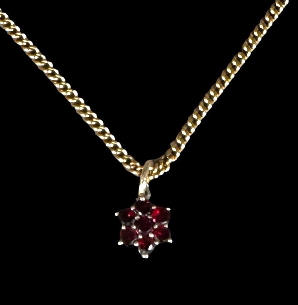 Antique Vermeil Garnet Necklace: A sweet and petite necklace with a small floral of prong set European cut garnets, set in a marked silver frame, suspended from a marked 14K yellow gold chain, apprx 9"L, 5 grams. Condition: very 