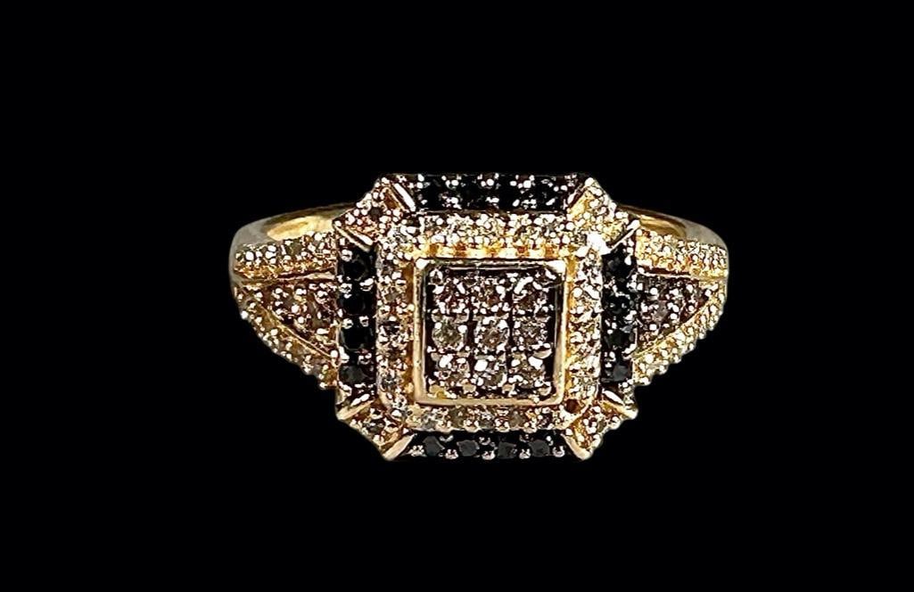 Black and White Diamond Ring: 14K gold ring set with melee white and black diamonds, weighs 4 grams, size 7. missing one diamond!