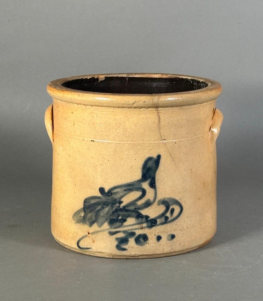 Stoneware Crock with Cobalt Blue Bird Decoration: Stoneware Crock with Cobalt Blue Bird Decoration, with applied handles, decorated with a bird with head facing upwards, over a flourish. Dimensions: 7.5 in.h. x 8.5 in. dia. Condition: Old chip to cob