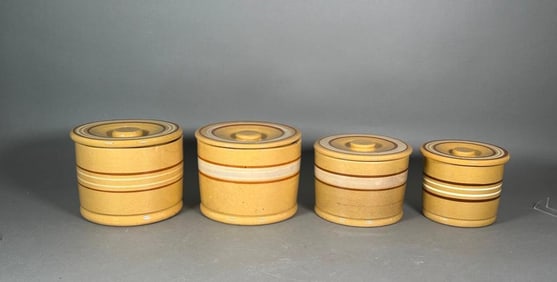 Group of Four Yellow Ware Cannisters