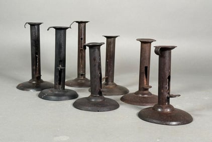 Seven Assorted Antique American Sheet Iron Hogscraper Candlesticks