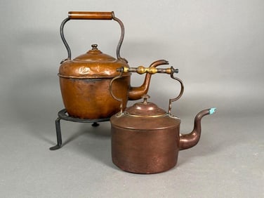 Two Copper Teapots and an Iron Trivet
