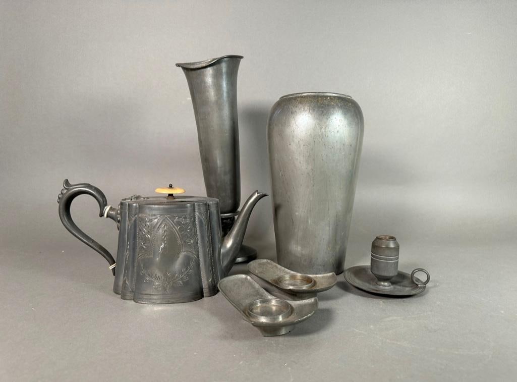 Assorted Pewter Lot: Assorted Pewter Lot, comprising 2 vases, a teapot, chamber stick and 2 saucers.Â Dimensions: 12 in.h. Condition: As is lot. One vase dented and bent.