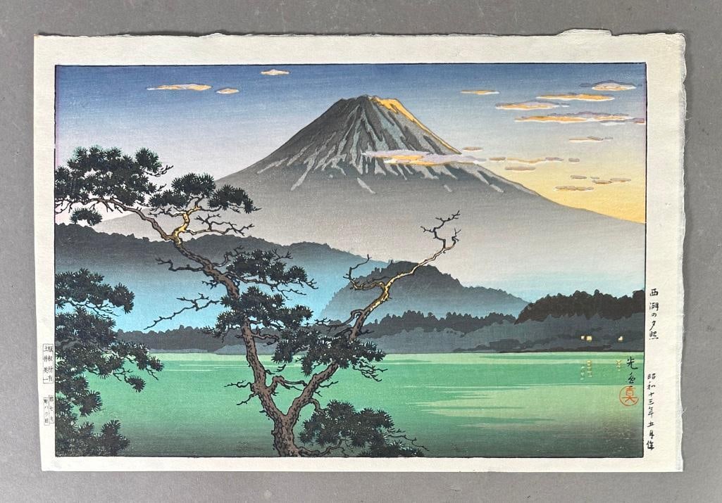 Tsuchiya Koitsu Color Woodblock Print, "Mount Fuji from Lake Sai" : Tsuchiya Koitsu (Japanese 1870-1949) "Mount Fuji from Lake Sai," c.1960's-1970's, color woodblock print, stamped signatures and inscriptions, unframed, loose sheet. Dimensions: 10.5 x 
