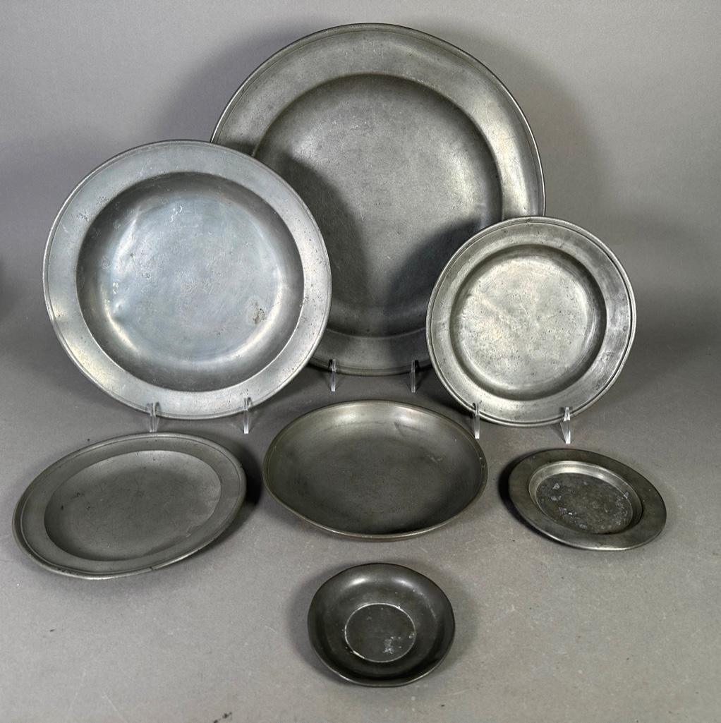 Lot of Seven Antique Pewter Dishes: Lot of Seven Antique Pewter Dishes, comprising one large charger and six smaller dishes, most are marked. Dimensions: Condition: Antique condition with wear and dents. Some marks worn.Â