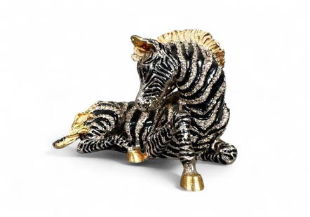 Jay Strongwater Swarovski Jeweled and Enameled Zebra Table Decoration: Jay Strongwater Swarovski Jeweled and Enameled Zebra Table Decoration, cast as a recumbent Zebra in black silver and gold tones, encrusted allover with Swarovski crystals, with signature plate to base