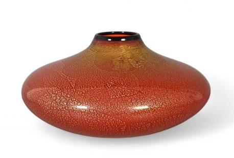 Chatham Glass Company Art Glass Vase: Chatham Glass Company Art Glass Vase, compressed circular form in orange glass internally decorated with a metallic gilt foil swirl. Signed and dated 2007 to base. Dimensions: 13 in. dia. 8 in.h. Cond